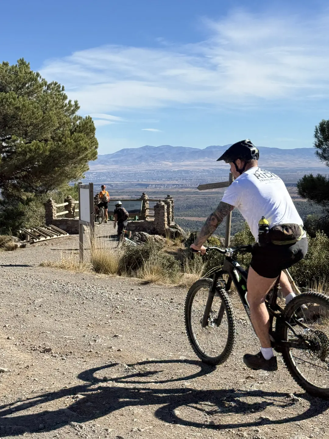 Ride Trans Nevada rider arriving at a mountain viewpoint in the Sierra Nevada