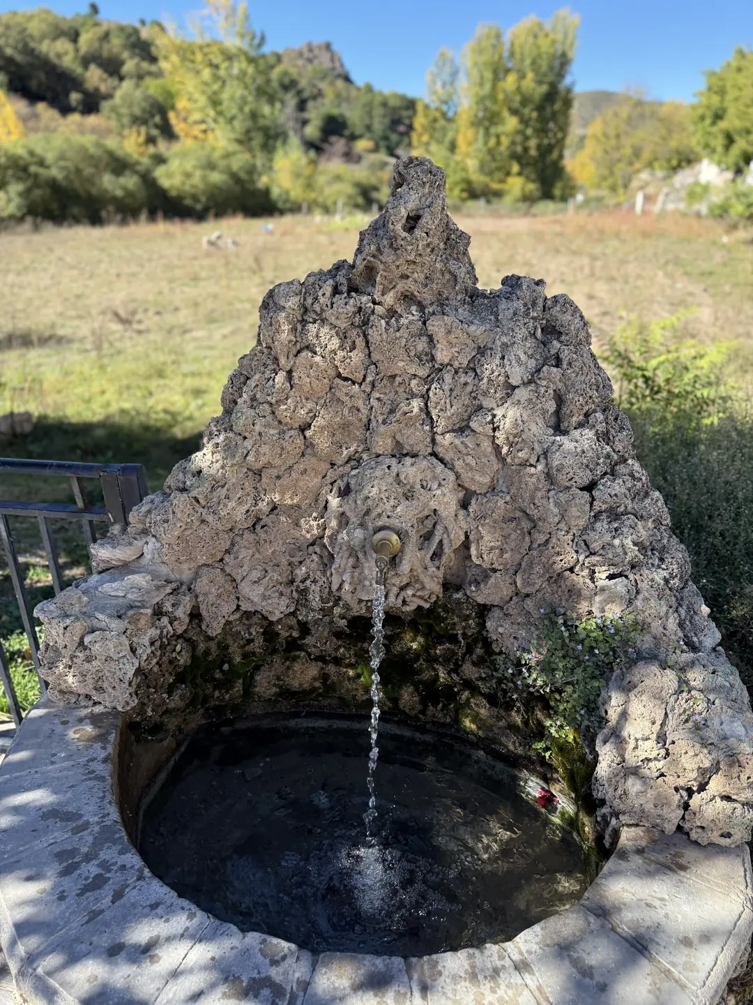 Traditional stone fountain with fresh mountain water in the Alpujarras, Sierra Nevada